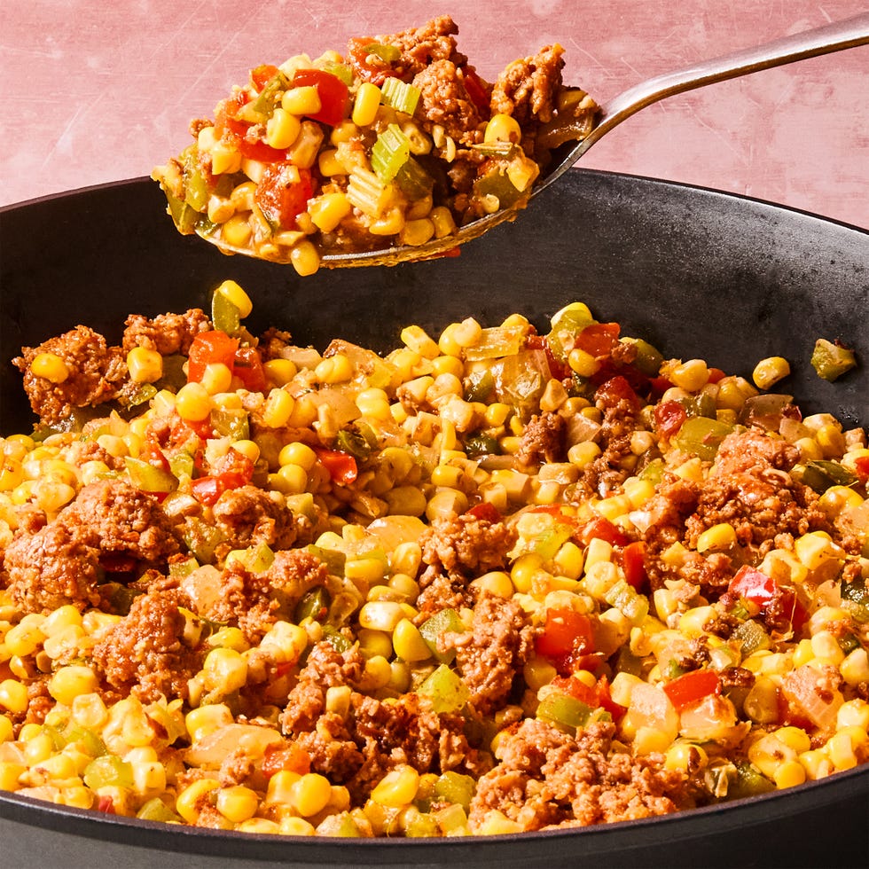 sausage, corn, and peppers in a skillet
