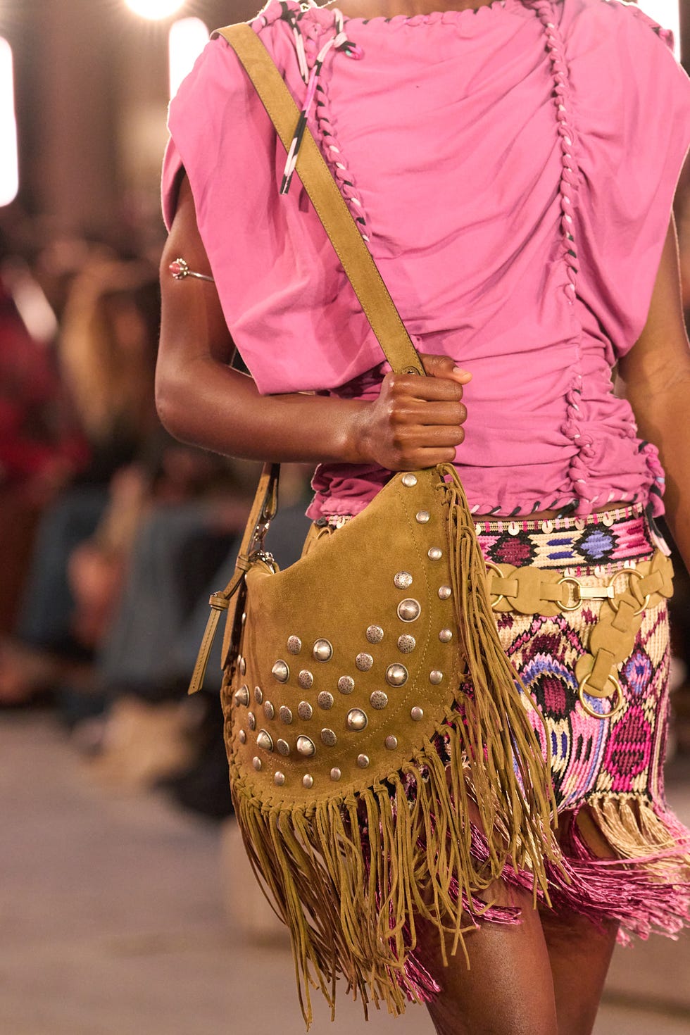 Fashion model showcasing a vibrant outfit with accessories