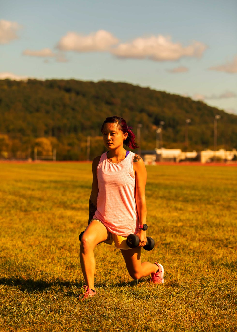 Amanda Furrer doing a lunge on the track.