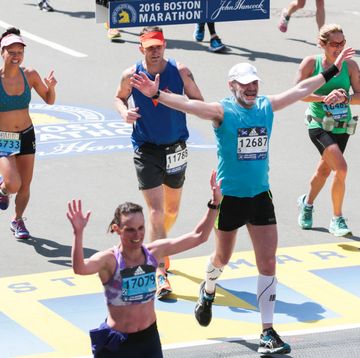 boston, ma 041816 runners cheers as they cross the finish line of the 2016 boston marathon on boylston street on monday, april 18, 2016 staff photo by nicolaus czarnecki photo by nicolaus czarmeckimedianews groupboston herald via getty images