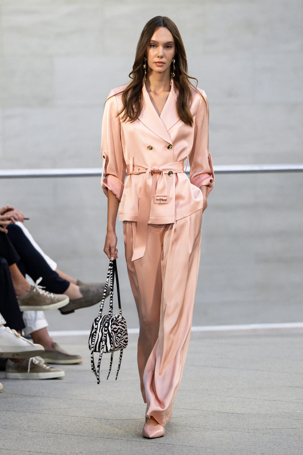 It displays a sophisticated group model on the runway