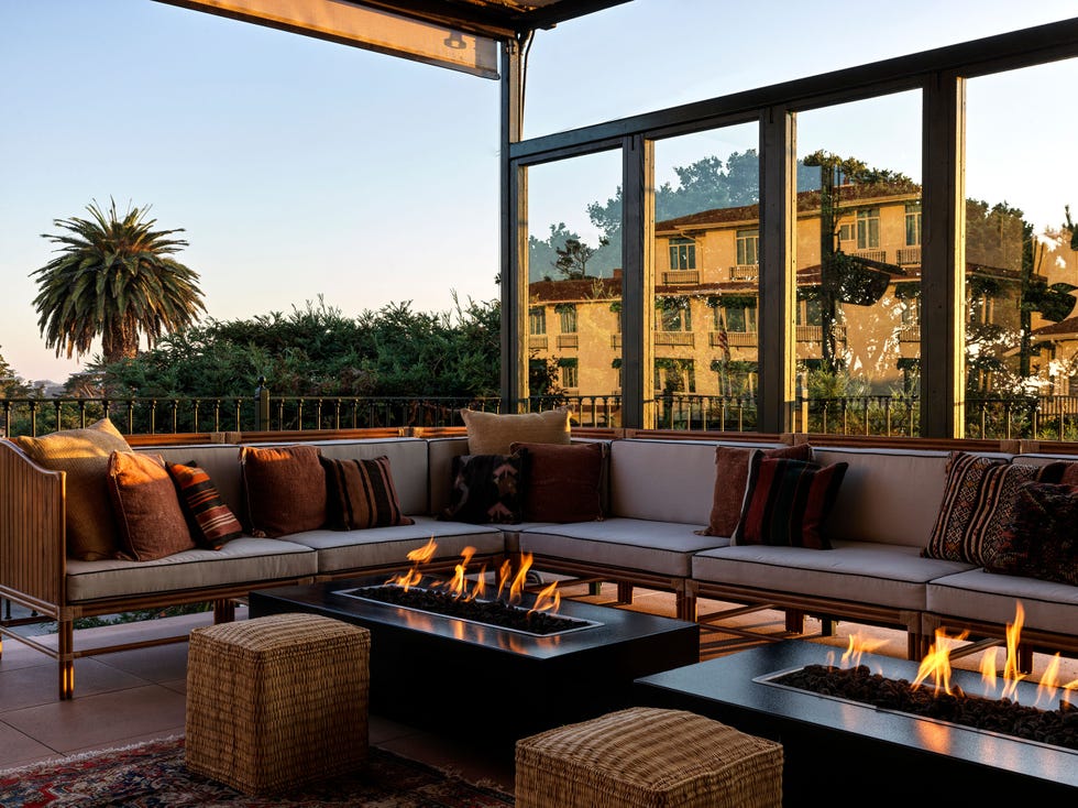 outdoor lounge area with fire feature and seating