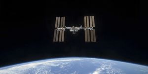 March 25, 2009 - The International Space Station, backdropped by the blackness of space and Earth's horizon.