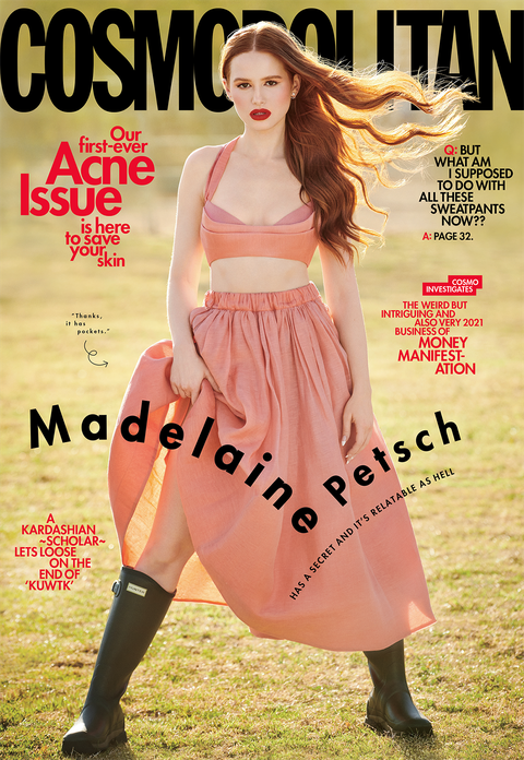 march 2021 cosmopolitan cover of actress madelaine petsch, wearing a pink bustier and skirt and black hunter boots, in front of grass
