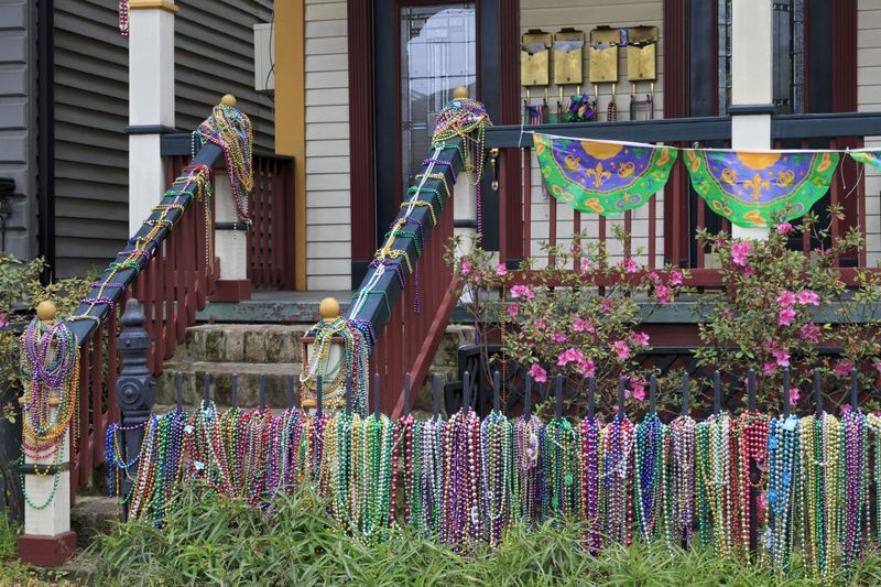 mardi gras porch with beads and banners