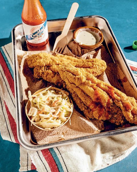 mardi gras foods recipes fried catfish on tray with hot sauce and slaw