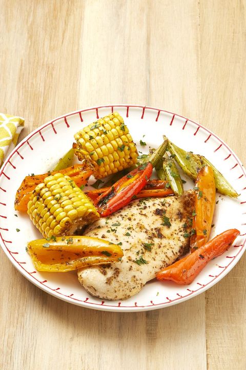mardi gras foods recipes sheet pan cajun chicken and corn with peppers on plate