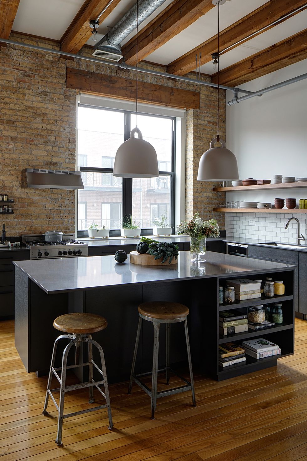 brick kitchen with industrial pendant