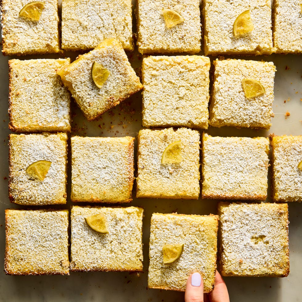 margarita bars topped with powdered sugar and candied lime