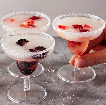 blackberry, raspberry, pineapple, and strawberry slushy margaritas in margarita style shot glasses