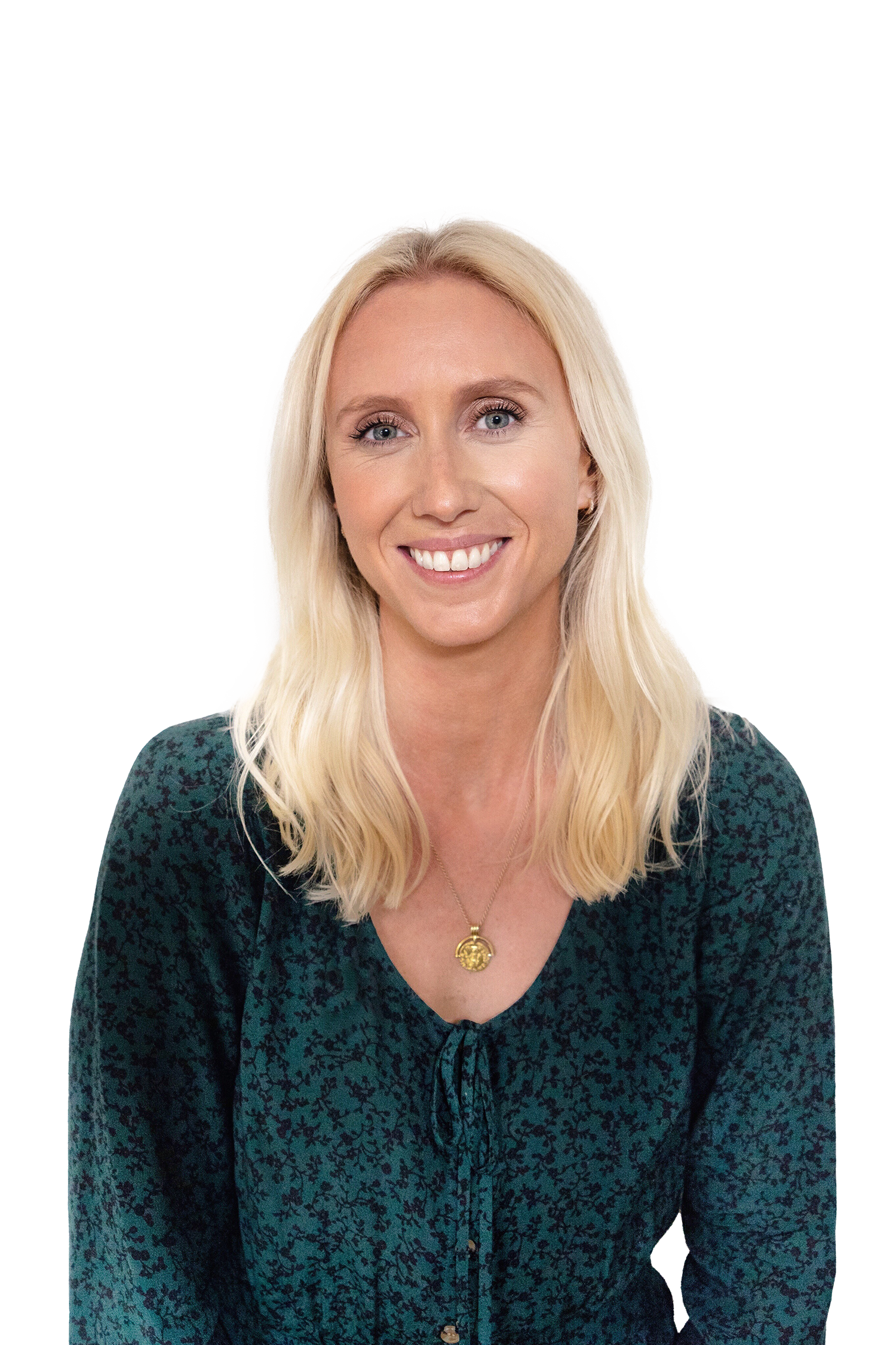 person wearing a green floral blouse with a necklace