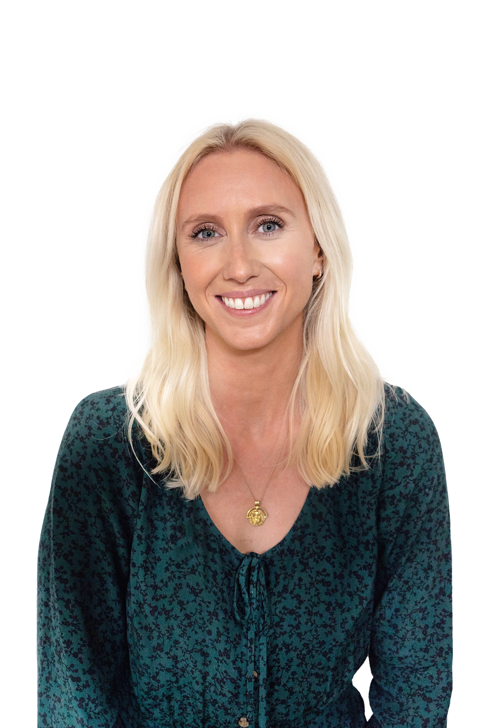 person wearing a green floral blouse with a necklace