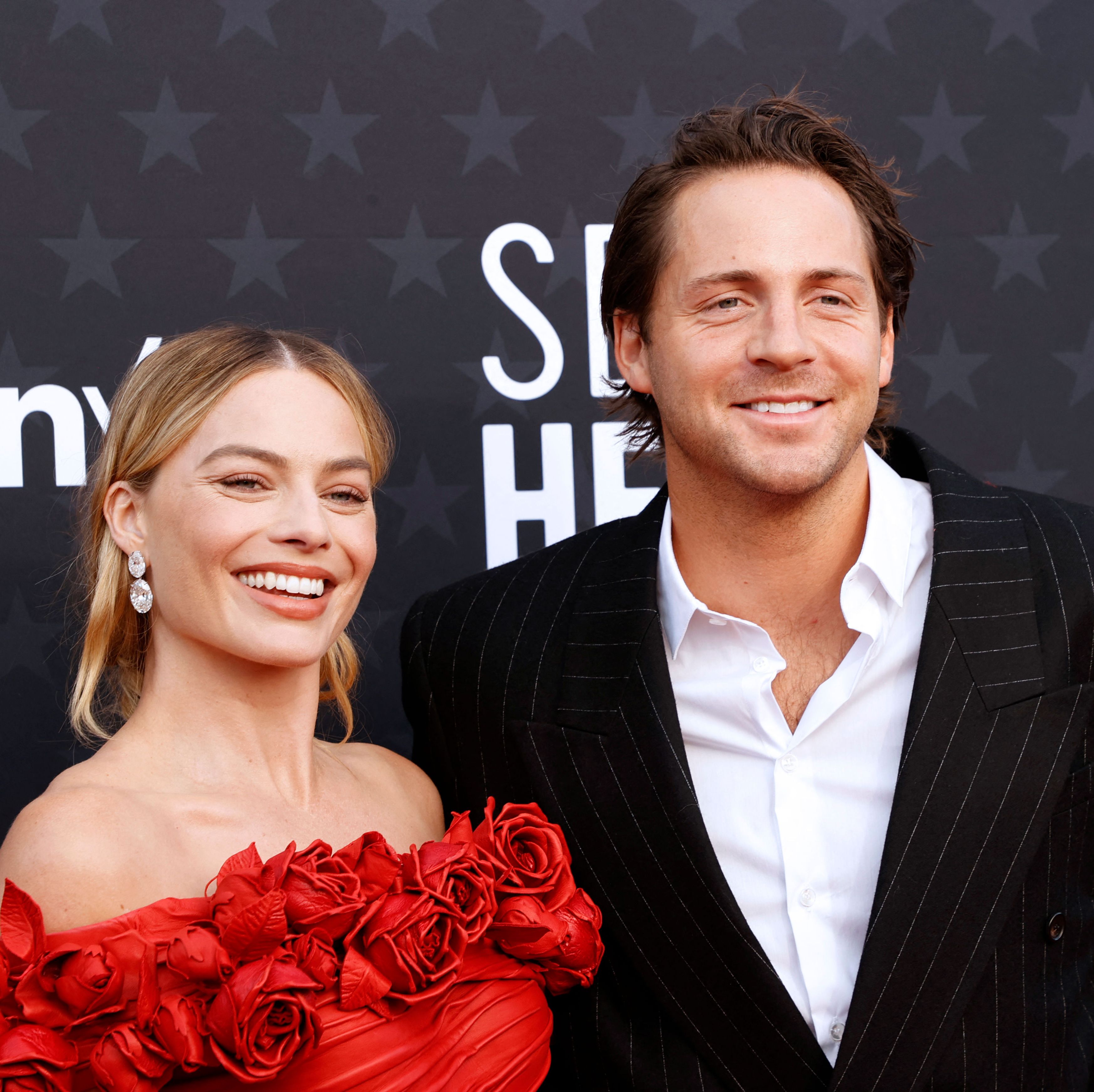 Her husband, Tom Ackerley, posed with her in a rare red carpet appearance for the couple.