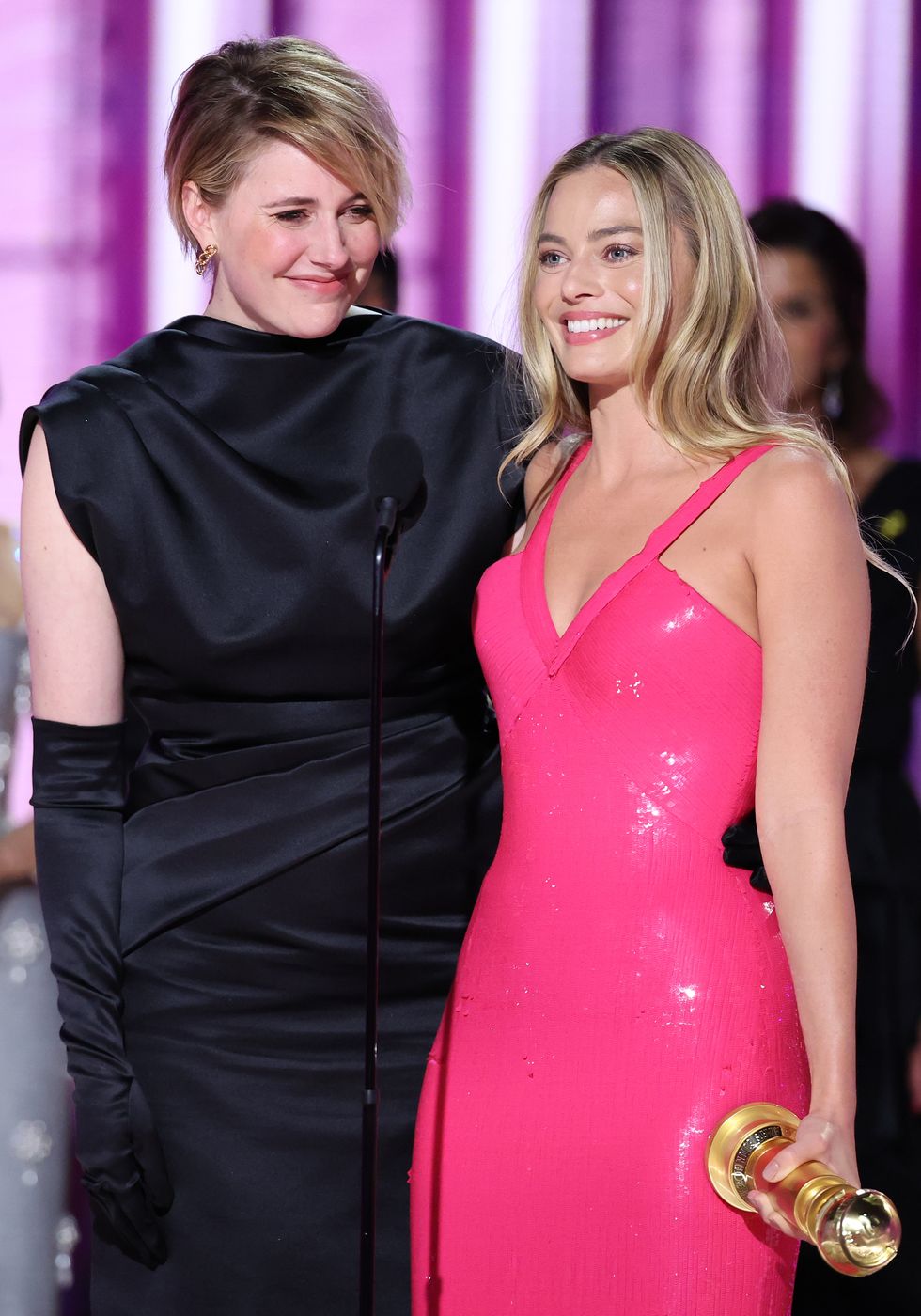 greta gerwig and margot robbie accept the award for cinematic and box office achievement for barbie at the 81st golden globe awards held at the beverly hilton hotel on january 7, 2024 in beverly hills, california photo by rich polkgolden globes 2024golden globes 2024 via getty images