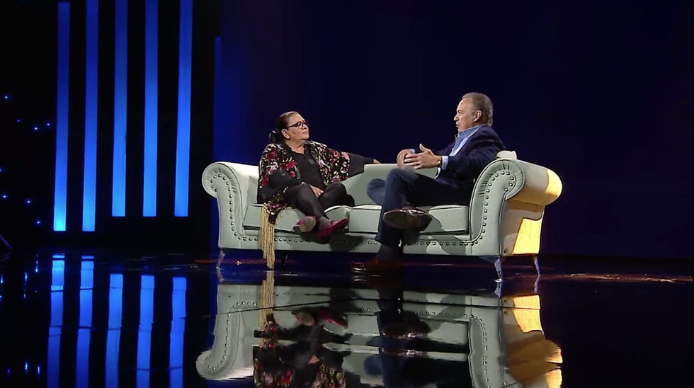 a man and woman sitting in chairs