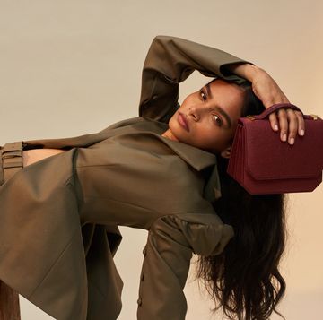 model with marici handbag