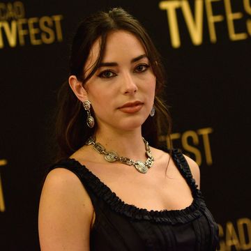 mariel morino in a black dress with a necklace, at a red carpet event