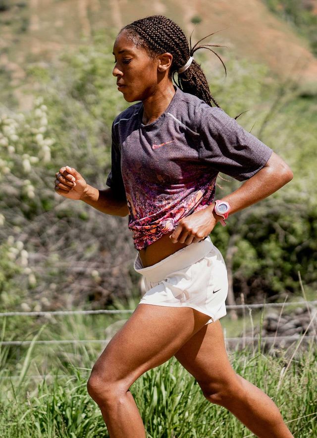 marielle hall running with braids and her hair tied back