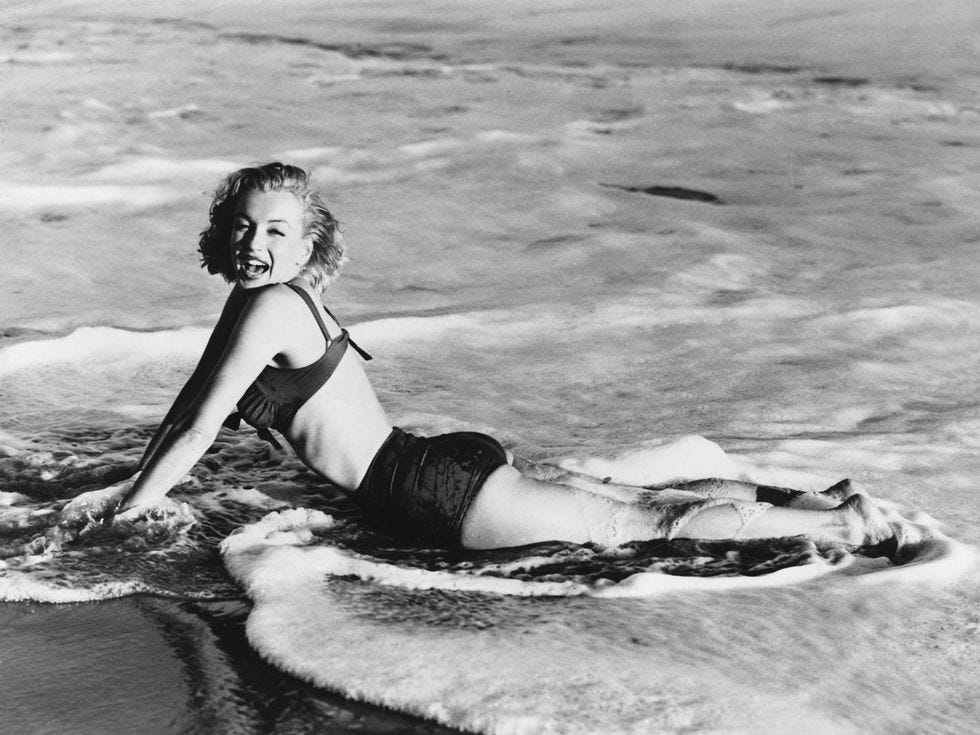 marilyn monroe lying in surf
