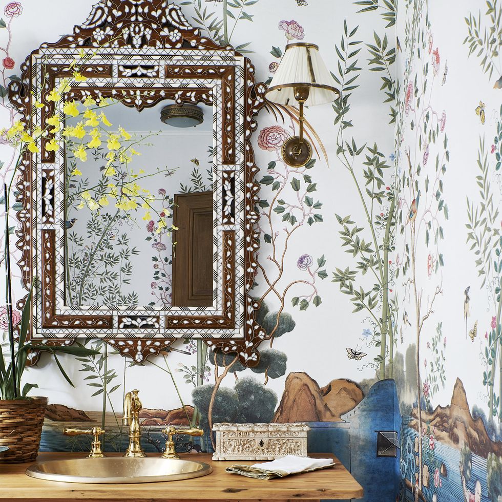 hand painted wallpaper iksel forms a florid backdrop for a bone inlay mirror charles jacobsen in the powder room