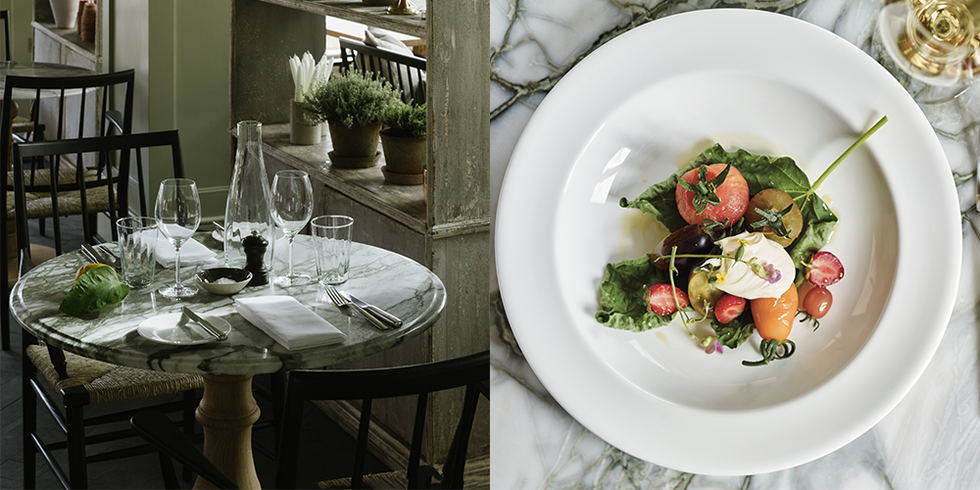 a dish of tomatoes and a table setting at marle restaurant heckfield place hampshire
