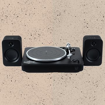 the house of marley record player and speakers combo against a textured background