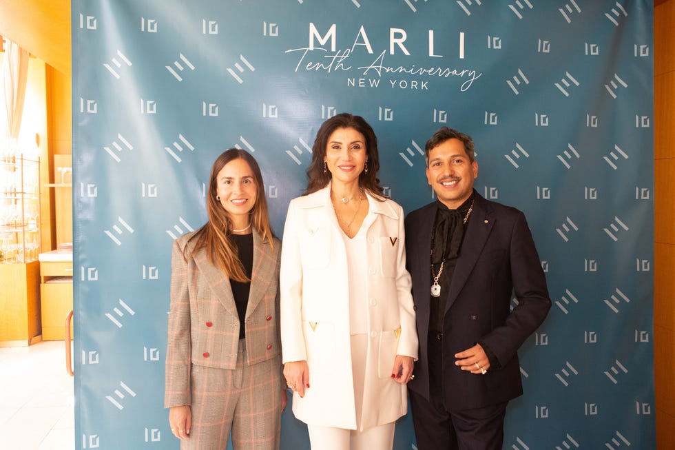 maral artinian stands alongside harper’s bazaar accessories editor miguel enamorado and town and country fashion and accessories director dania lucero ortiz