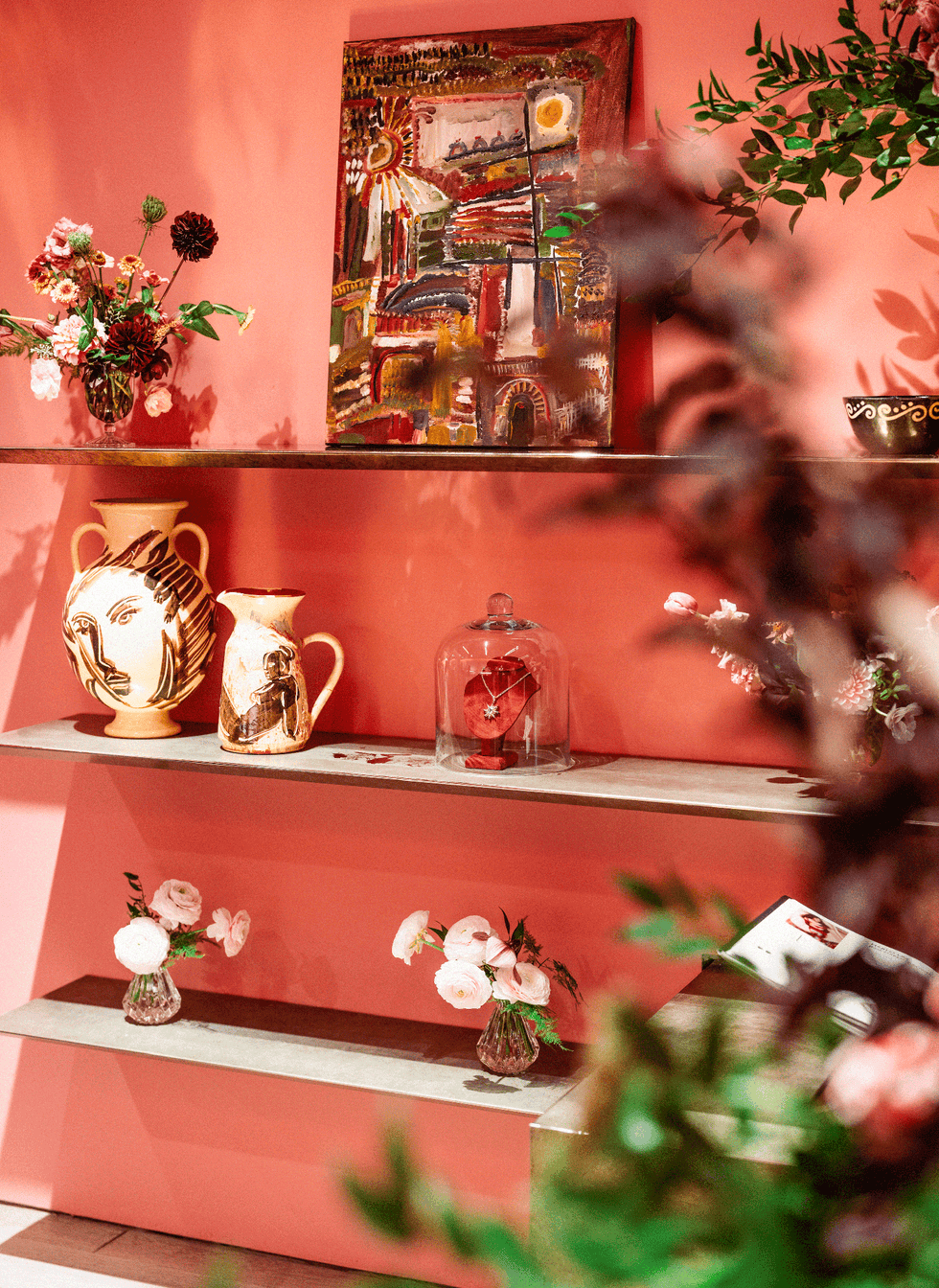 vases on a pink shelf