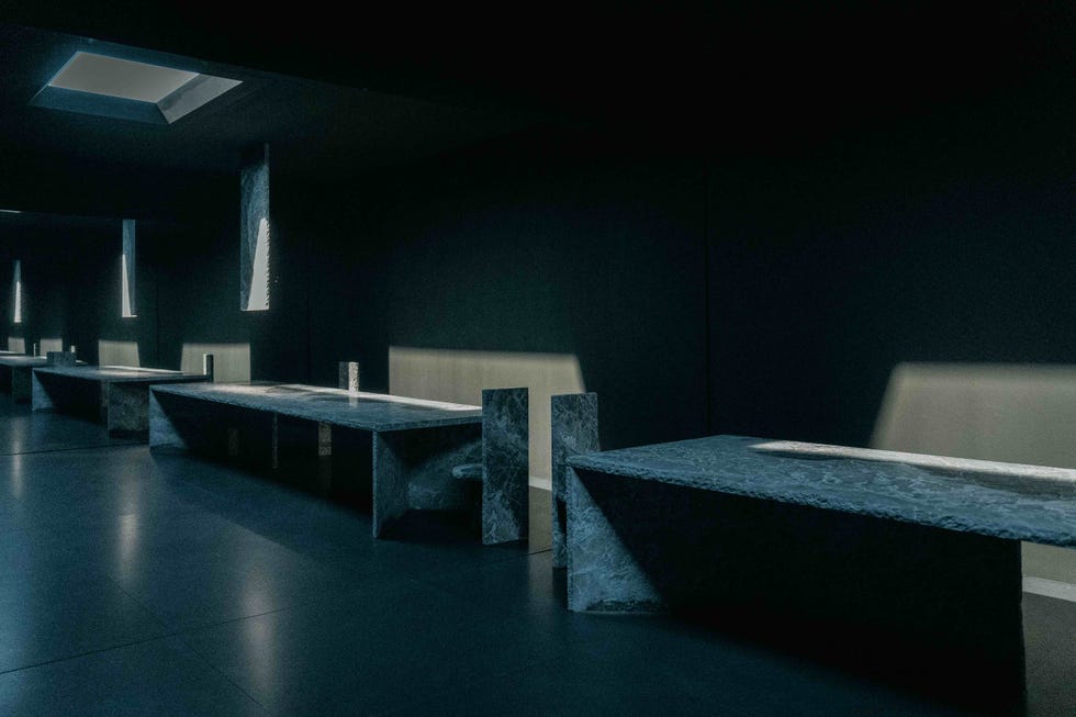 a room with benches and a light