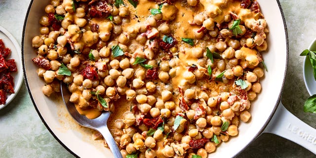 marry me chickpeas in a pan with a spoon
