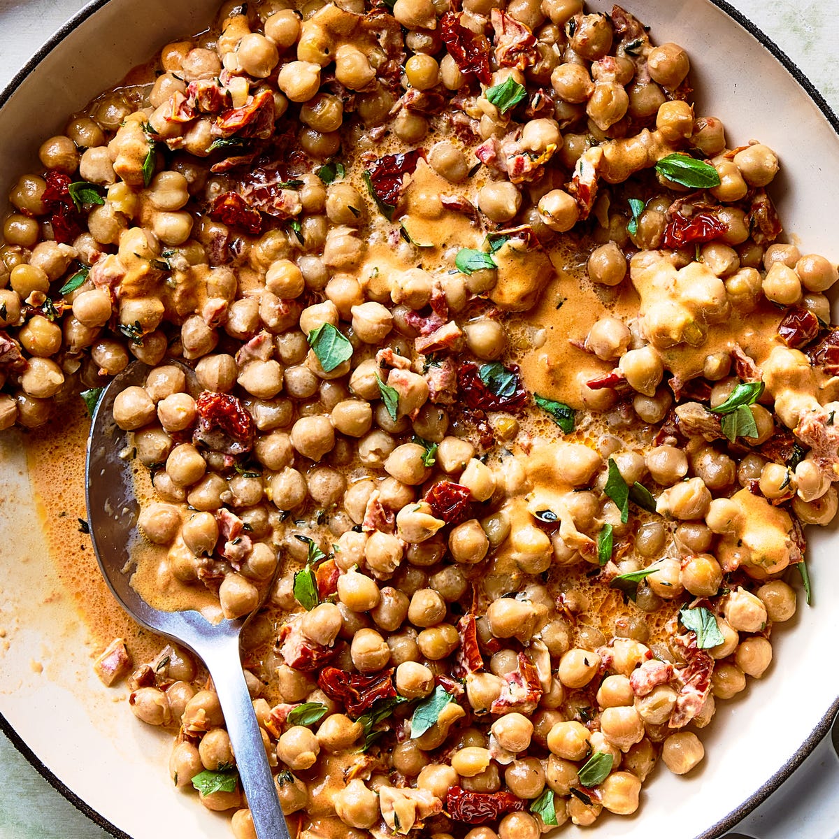 marry me chickpeas topped with basil