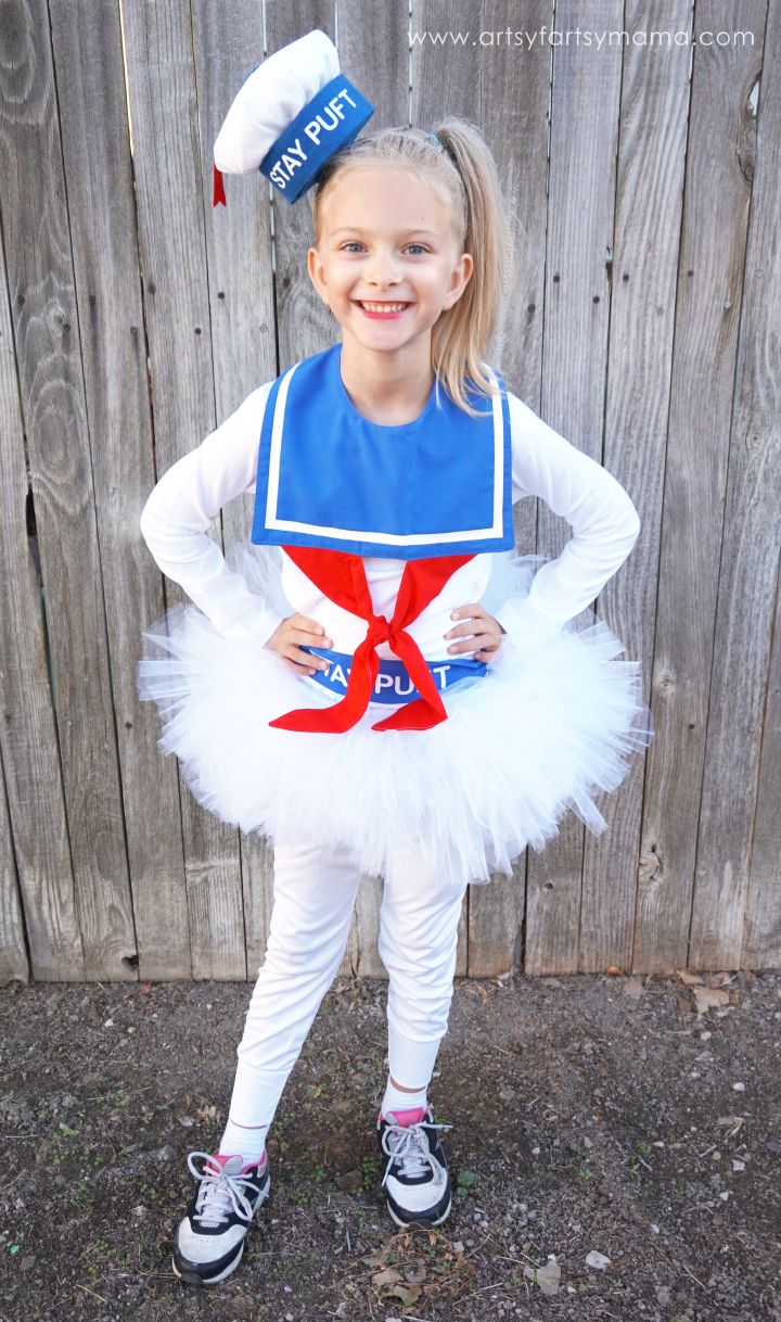 little girl in a stay puft marshmallow man costume