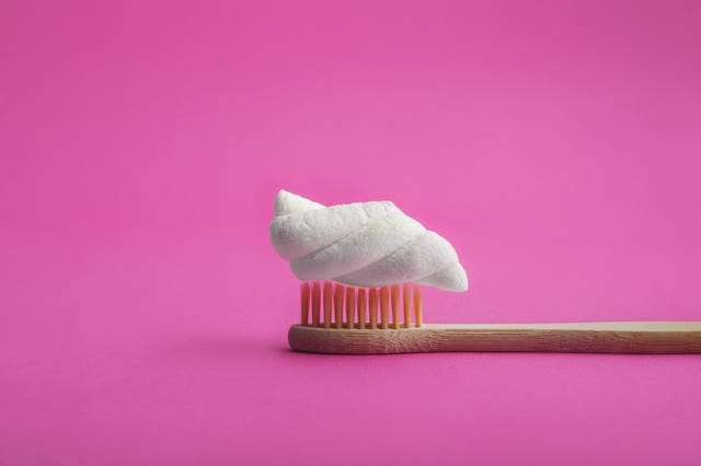 marshmallow on wooden toothbrush close up