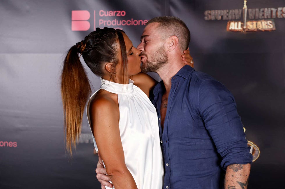 a man and woman kissing