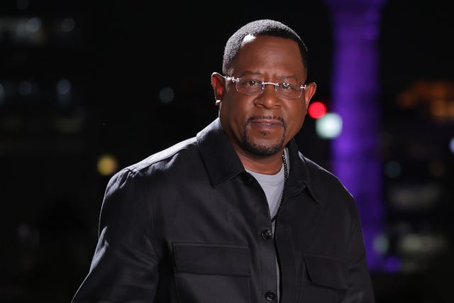 martin lawrence looks at the camera, he wears a black jacket and glasses