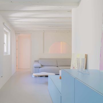 a room with a blue wall and white walls