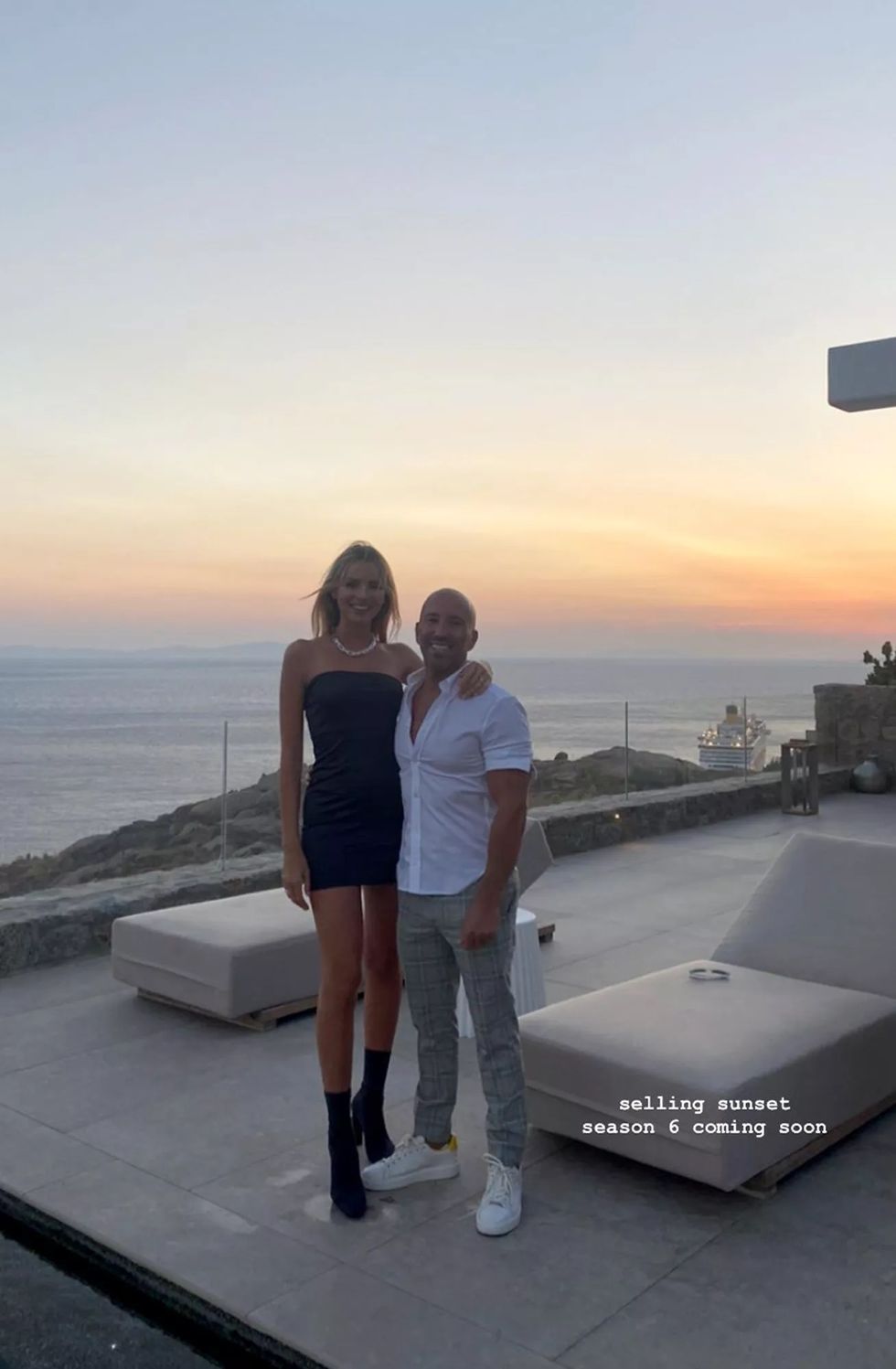 marie lou nurk and jason oppenheim in front of mykonos sunset