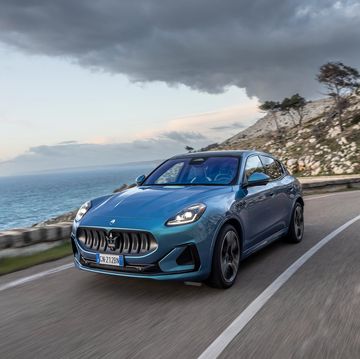 2025 maserati grecale folgore blue car on a road by the water