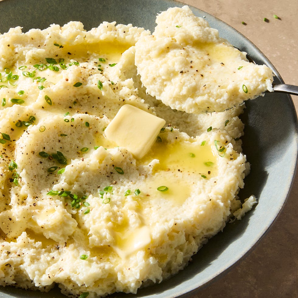 mashed cauliflower topped with sesame seeds and scallions
