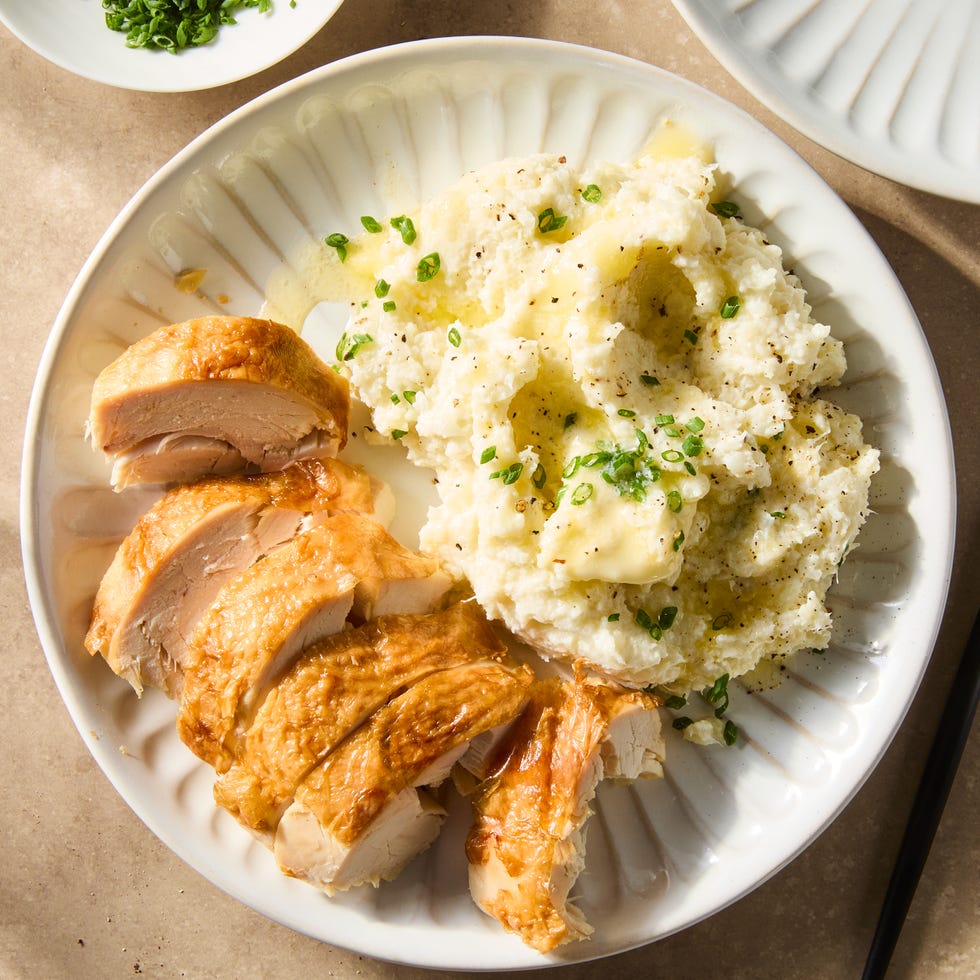 mashed cauliflower topped with sesame seeds and scallions