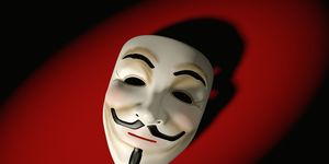 mask of guy fawkes on red