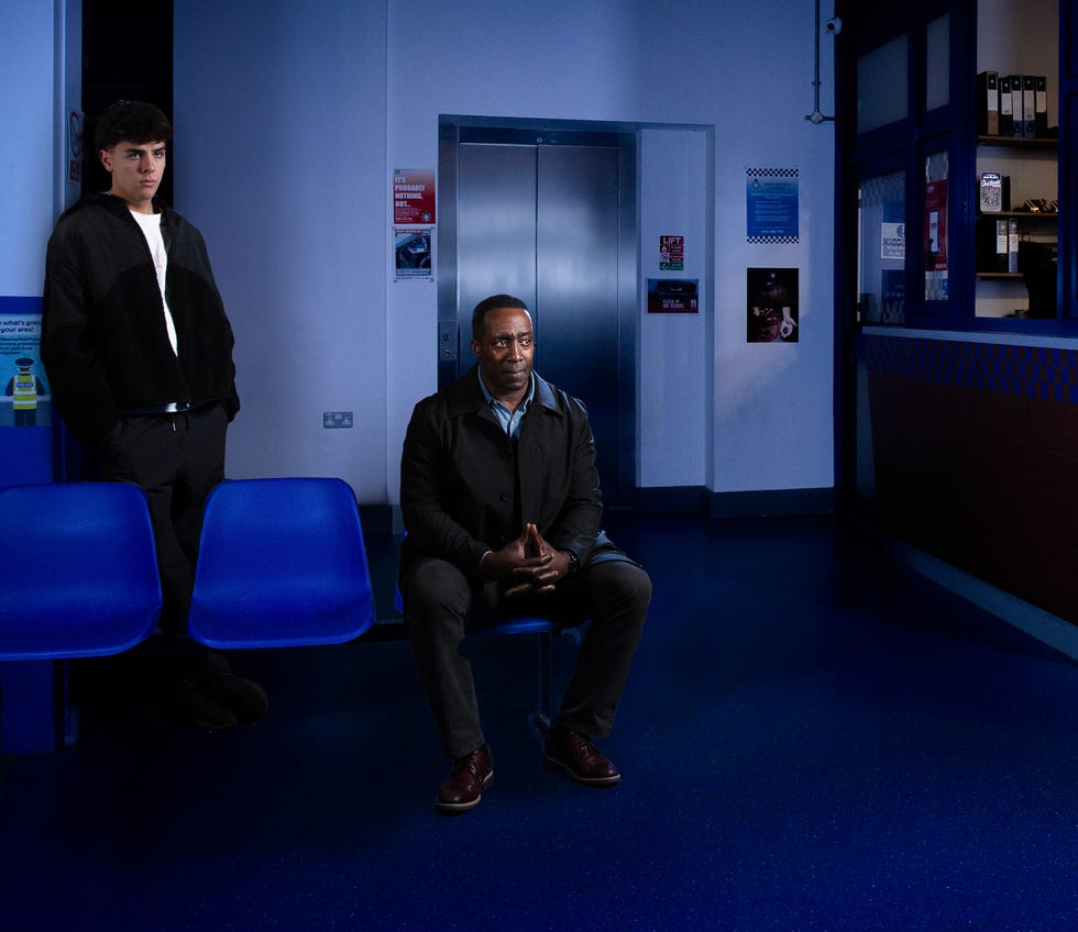 mason, ronnie bailey, in a waiting area during flashback scenes on coronation street