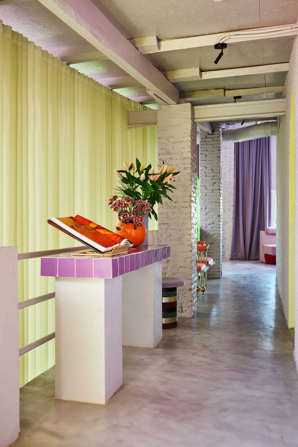 colourful industrial style hallway with yellow curtain divider