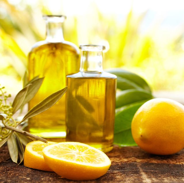 massage oil bottles with lemons and olive branch
