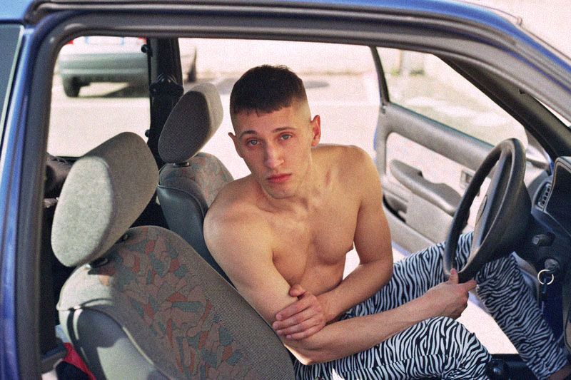Barechested, Vehicle, Car, Vehicle door, Car seat, Auto part, Truck driver, Chest hair, 