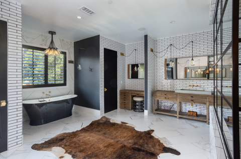 white and black bathroom with tub