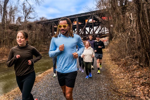 group of runners on gravel trail