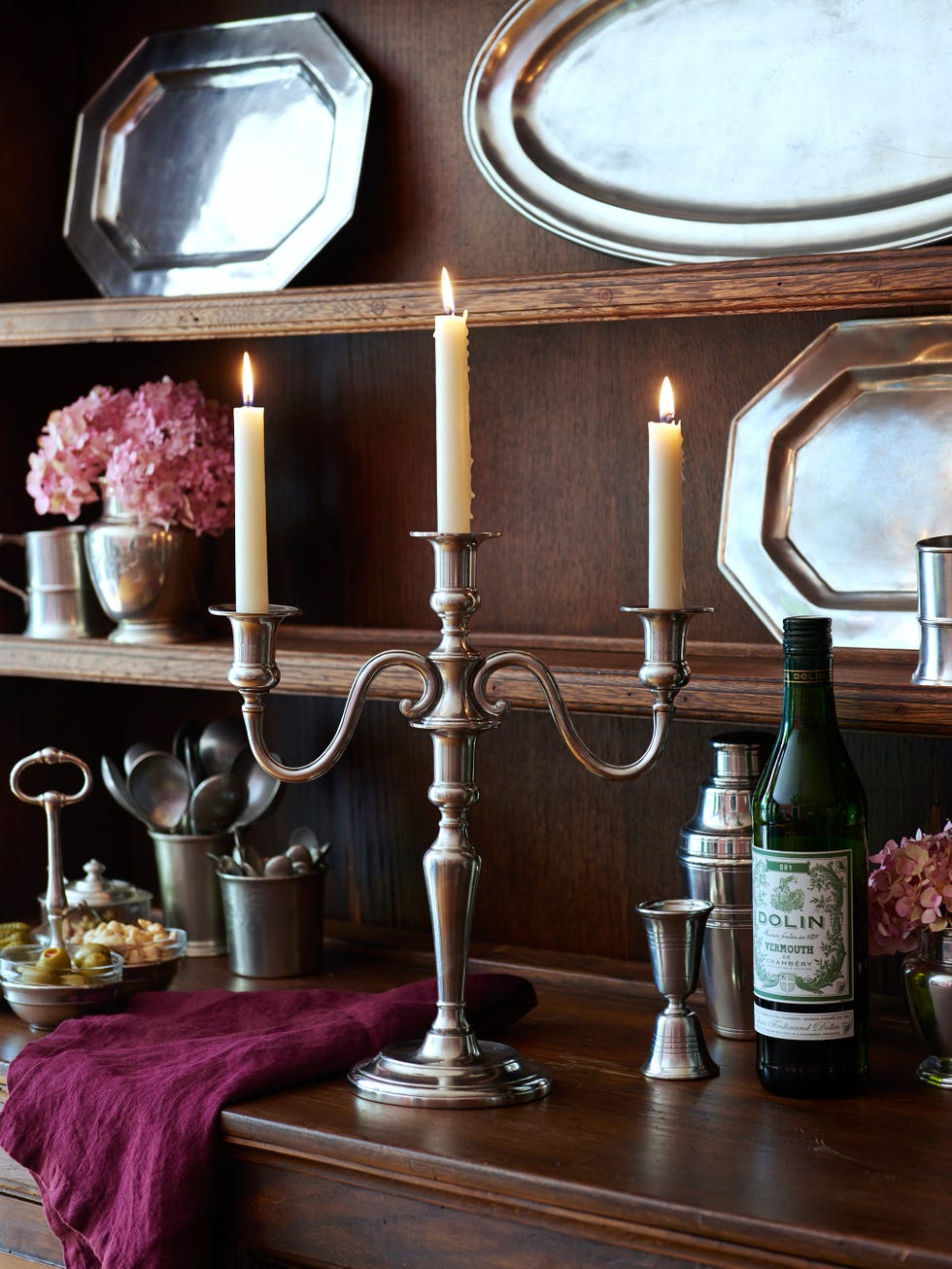 a table with candles and bottles