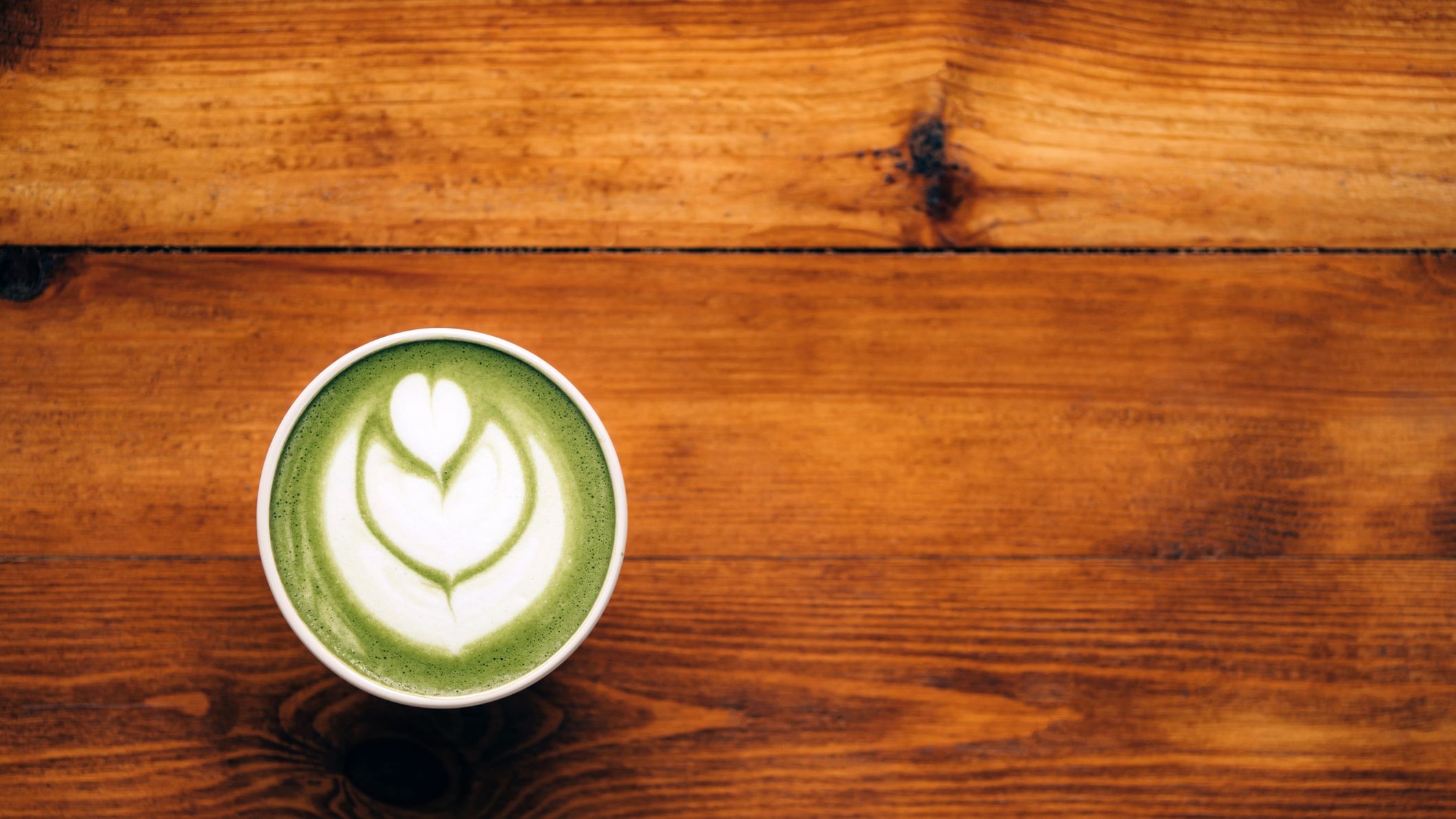 https://hips.hearstapps.com/hmg-prod/images/matcha-green-tea-latte-with-foam-art-in-ceramic-cup-royalty-free-image-1690569632.jpg?crop=1xw:0.84415xh;center,top