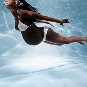 a woman in a swimsuit floating in water